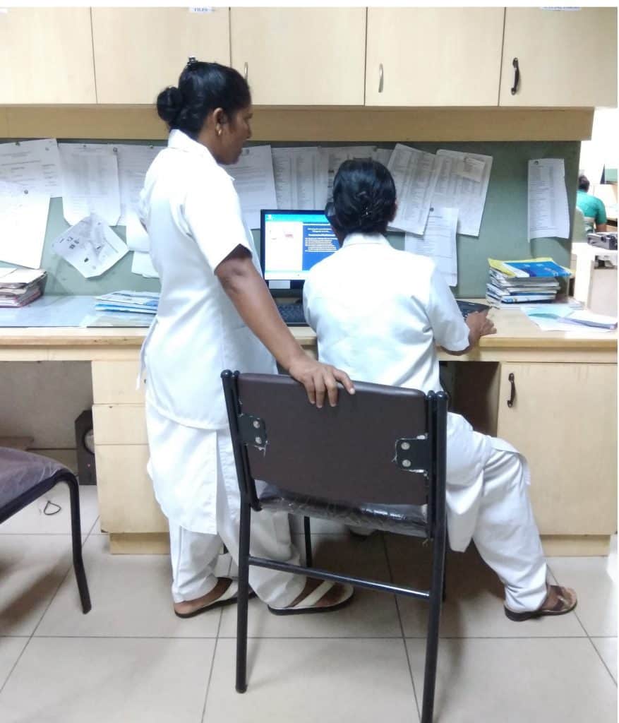 Nurses working at their desks. 