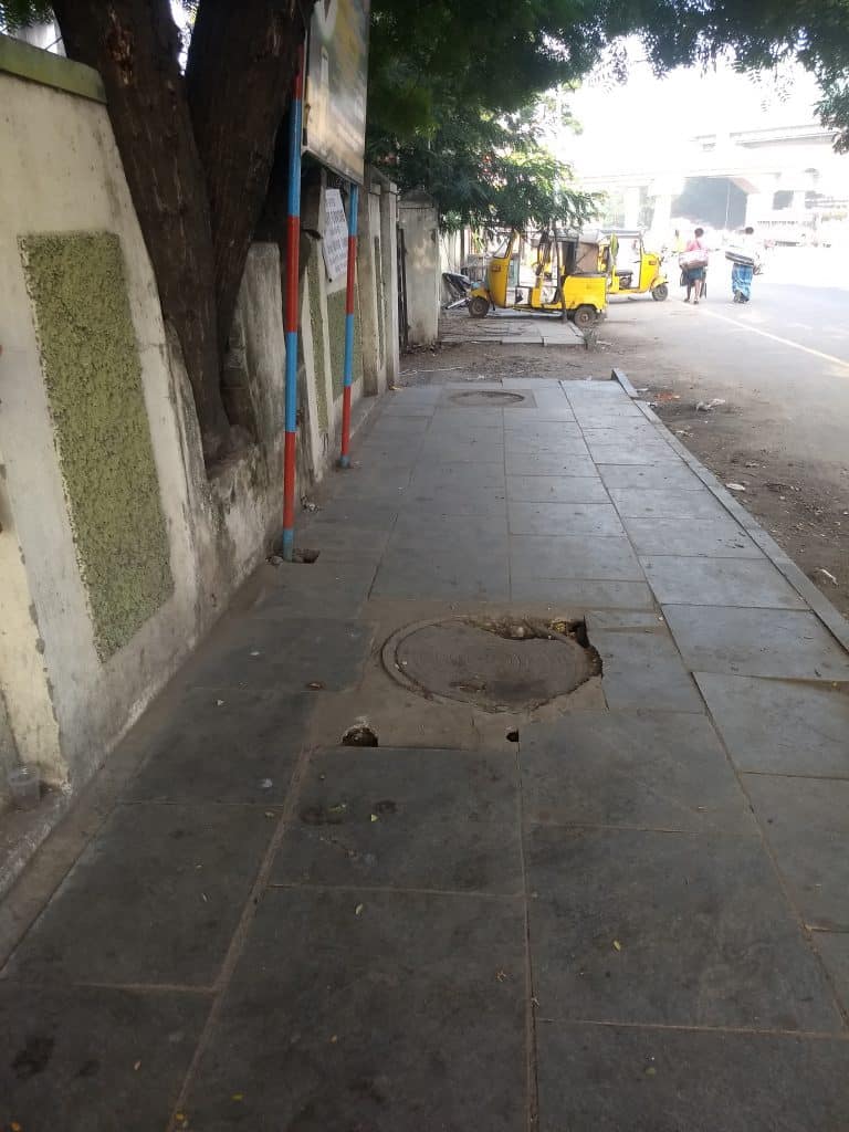 Badly finished manhole on footpath