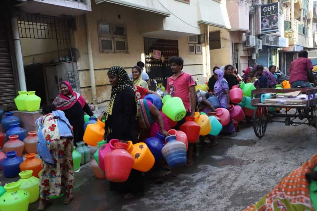 Chennai residents with pots waiting for water supply