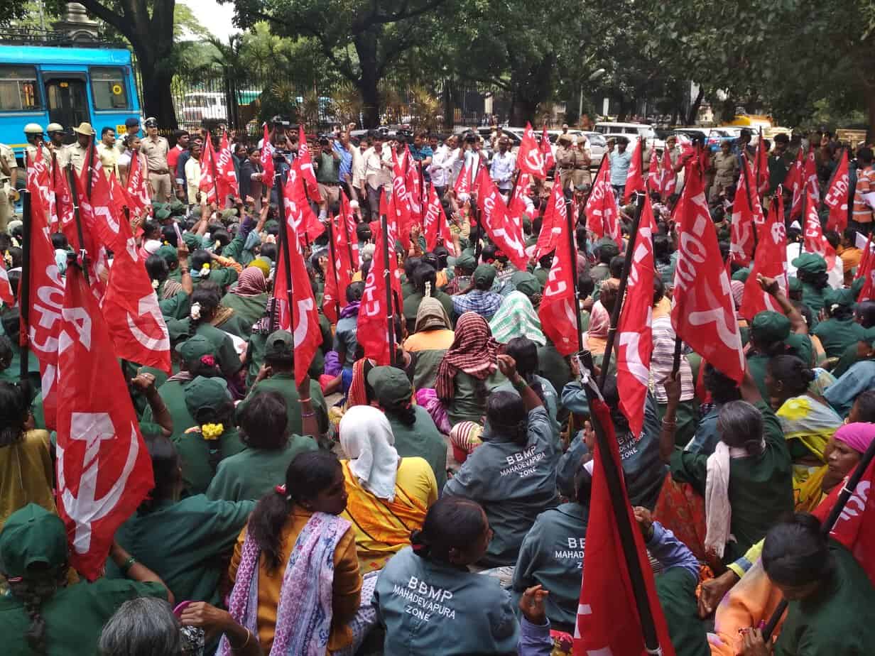 Thousands of workers from all eight BBMP zones gathered to protest outside the BBMP office. Pic: BBMP Powrkarmikara Sangha
