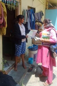 ASHA Sajidha surveying a neighborhood in Bengaluru