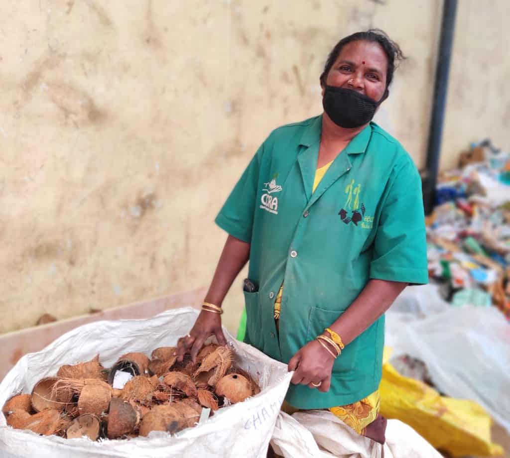 DWCC operator Kumudha with coconut shells at the centre
