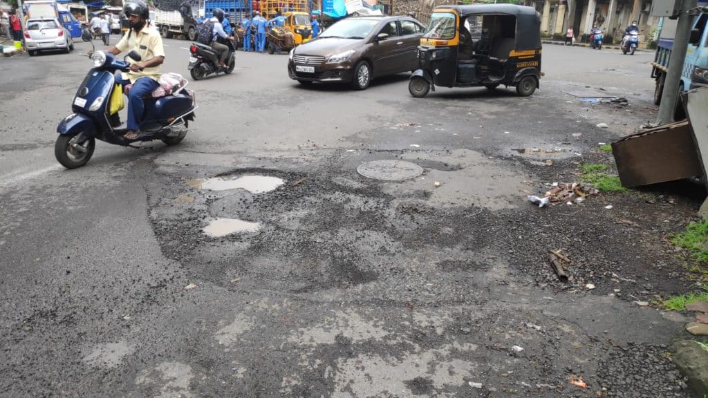 potholes on a road in Malad