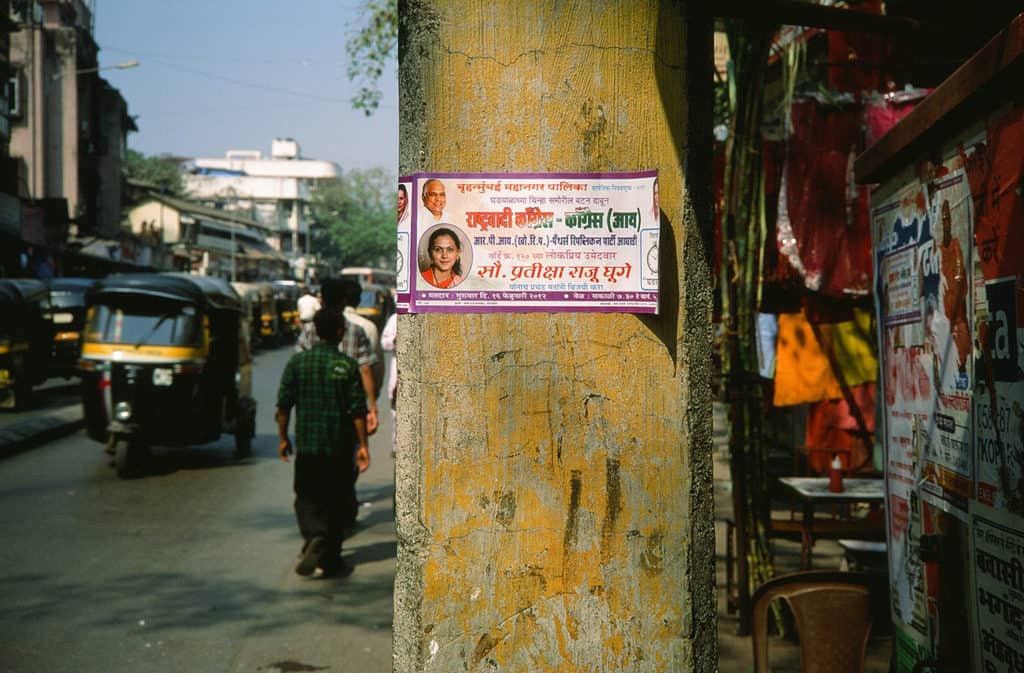 poster of a political candidate for BMC election on a street pole