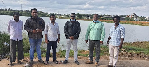 Captain Santhosh Kumar along with government officials at Ghatahalli lake