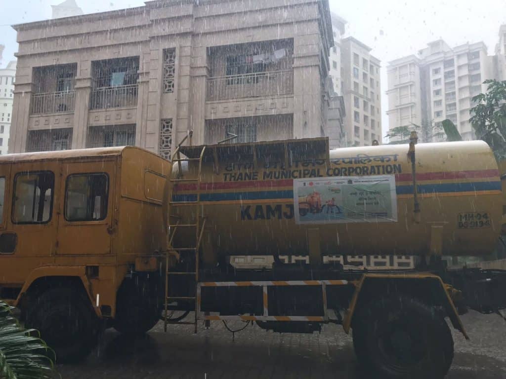 Thane municipality corporation tanker spotted along with sanitation workers in a housing society.