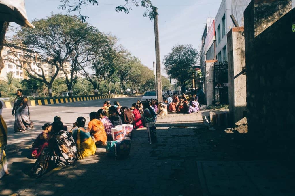 Women workers waiting at the palm beach labour naka in Navi Mumbai for work
