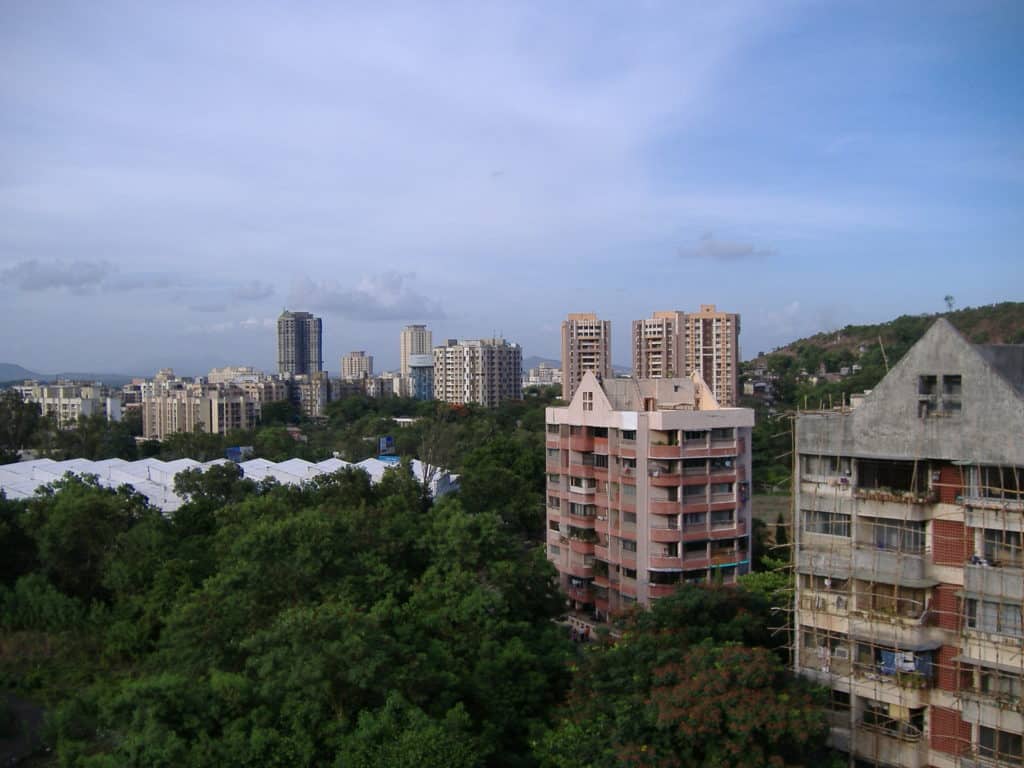 buildings among green cover in mumbai