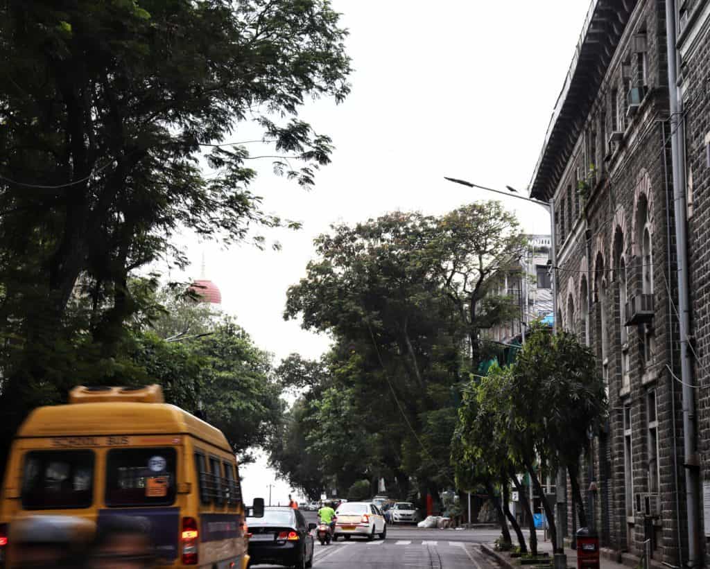 view of a school bus through traffic in south Bombay