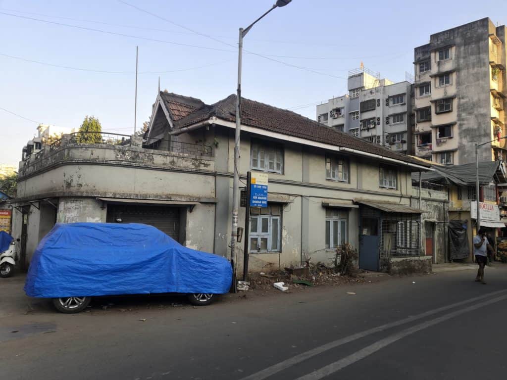 An empty house at the front of the goathan that will be razed in the realisgnment of the road