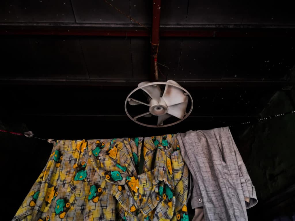 An assembled fan from different parts on a ceiling to combat the urban heat in Shivaji Nagar