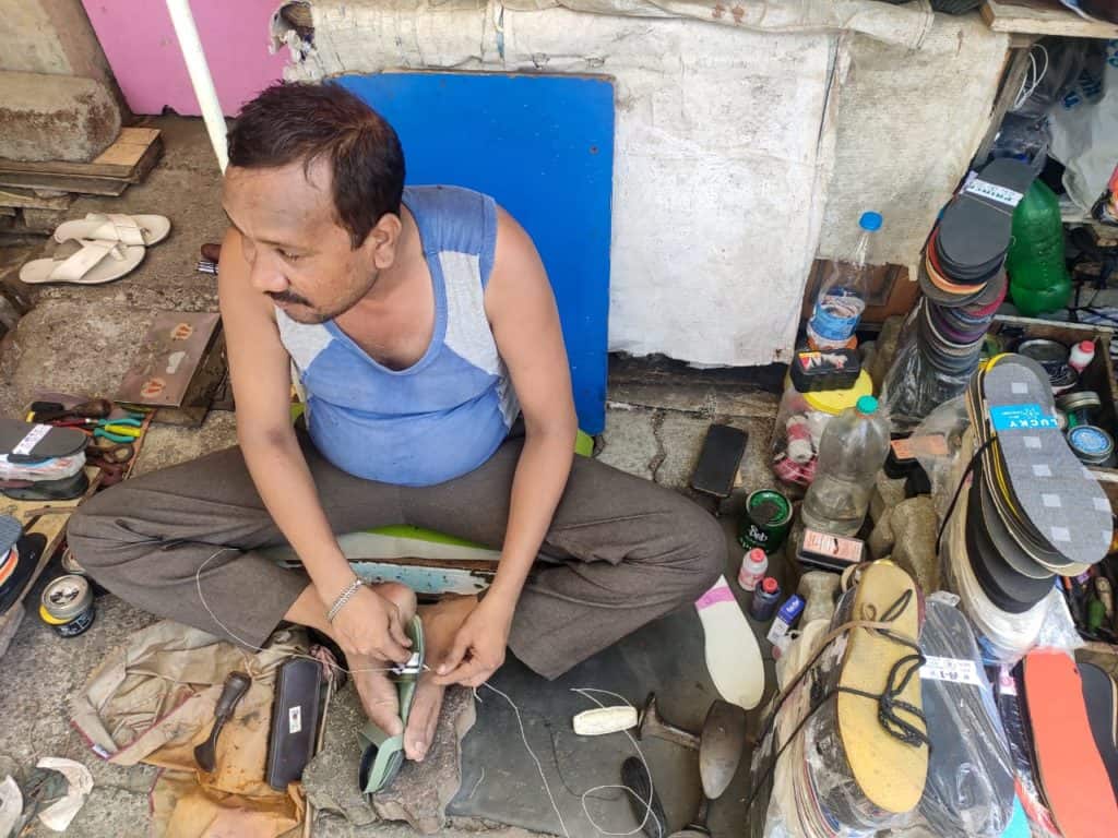 cobbler fixing a shoe