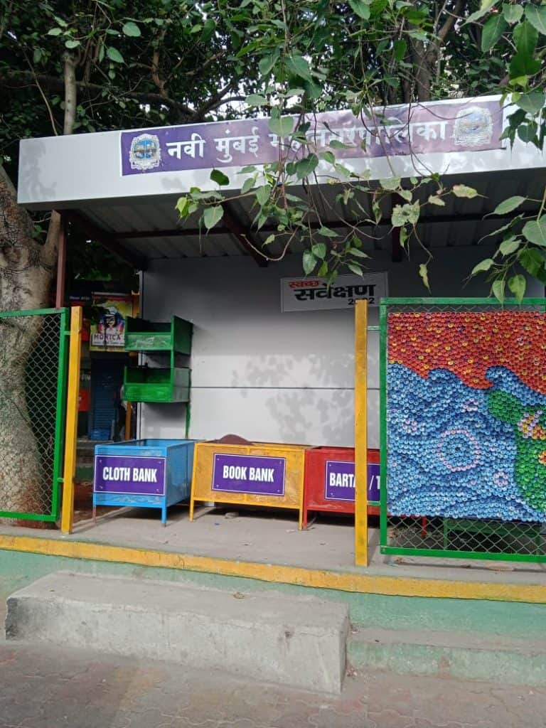 A station put up by NMMT that has food, cloth and utensil banks in bins