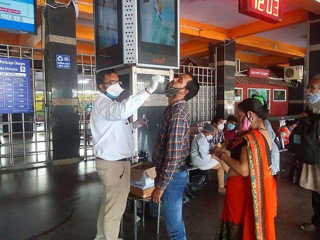 a citizen being tested for COVID at an airport 