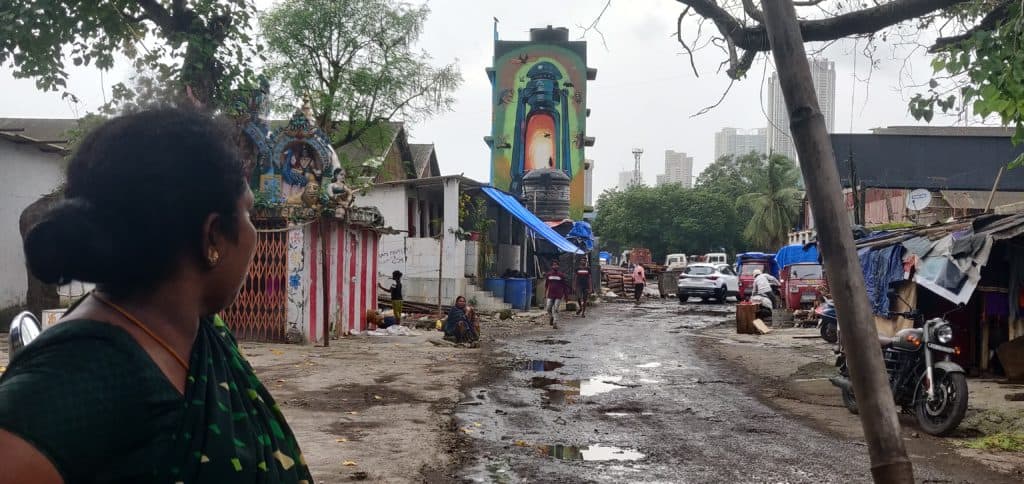 Laxmi is seen staring at the poor road leading to Indira Nagar slums.
