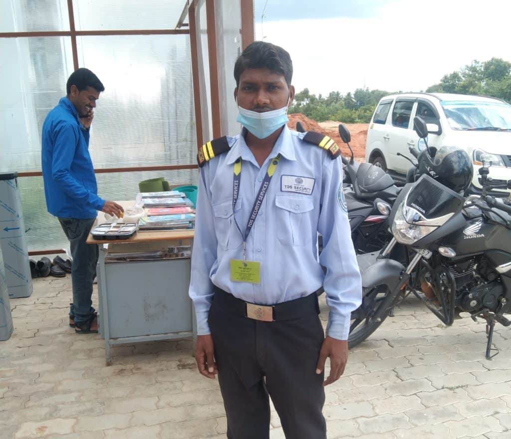 Mohamad Amar a migrant worker from Bihar in his guard uniform
