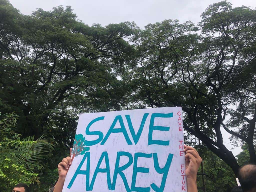 A placard held reads Save Aarey, save the future