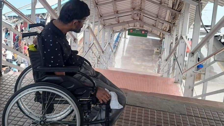 chennai-MRTS station-person on wheelchair-stairs in the station