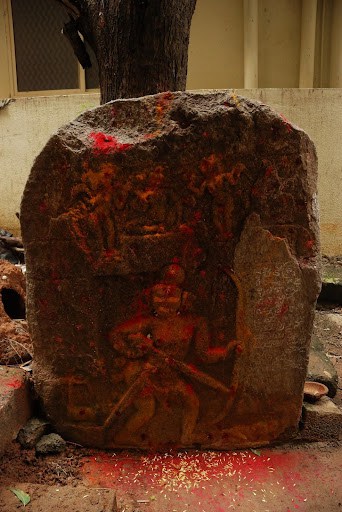 Stone inscription of a warrior smeared with vermilion 