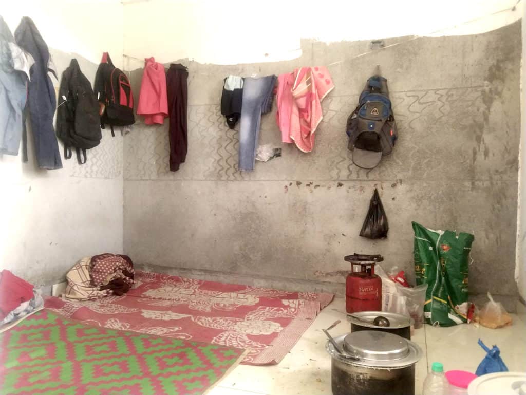 Migrant workers' rooms with clothes and cooking area