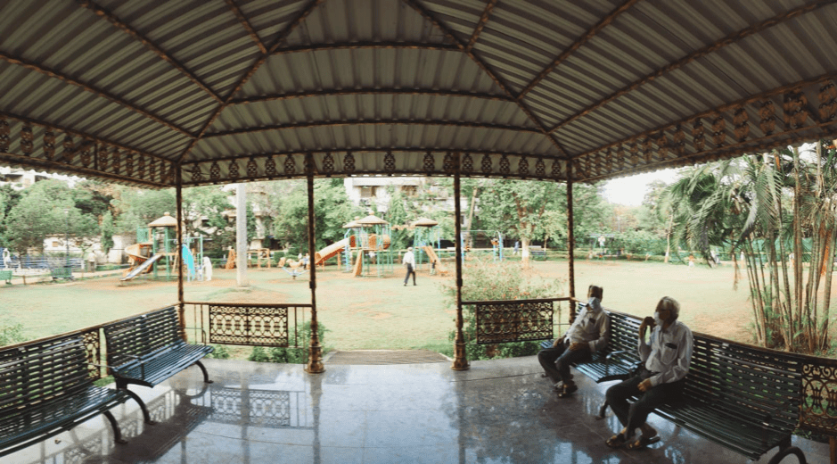 adults socially distancing at a park in Mumbai