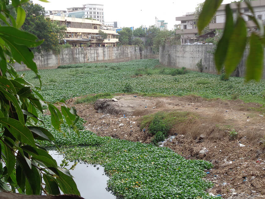 Soil from the ramps built on the river is dumped at Andheri Kurla Road