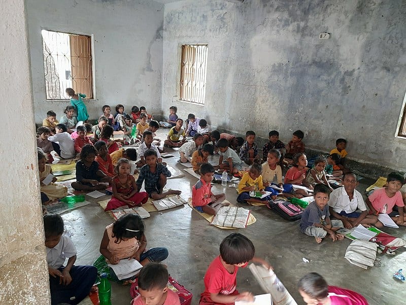 school children sitting in a government school