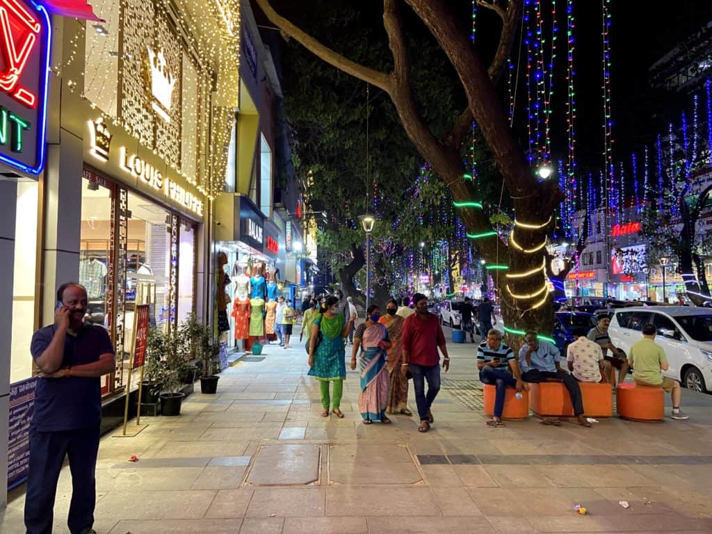 chennai-pondy bazaar-pedestrian plaza-people walking and sitting on the spaces allocated