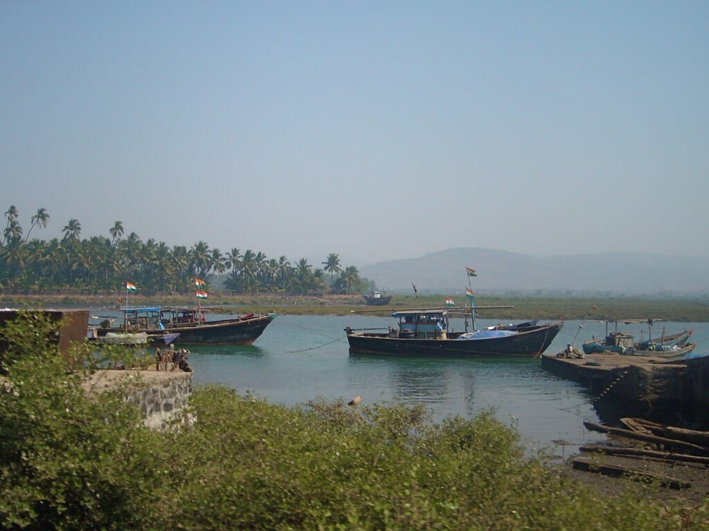 view of a river in Mumbai with fishing boats