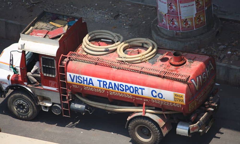 A red water tanker seen from a top angle