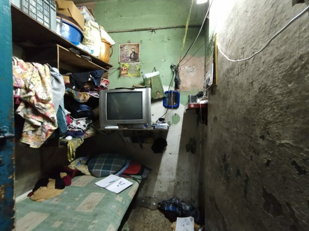 A room with a small cot in it. This is home to a five-member family in kannappar thidal