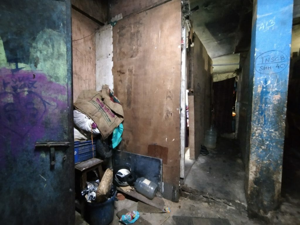 The picture shows the unsanitary living conditions at a corporation shelter allocated for homeless people who were evicted from the streets in Chennai to Kannappar thidal
