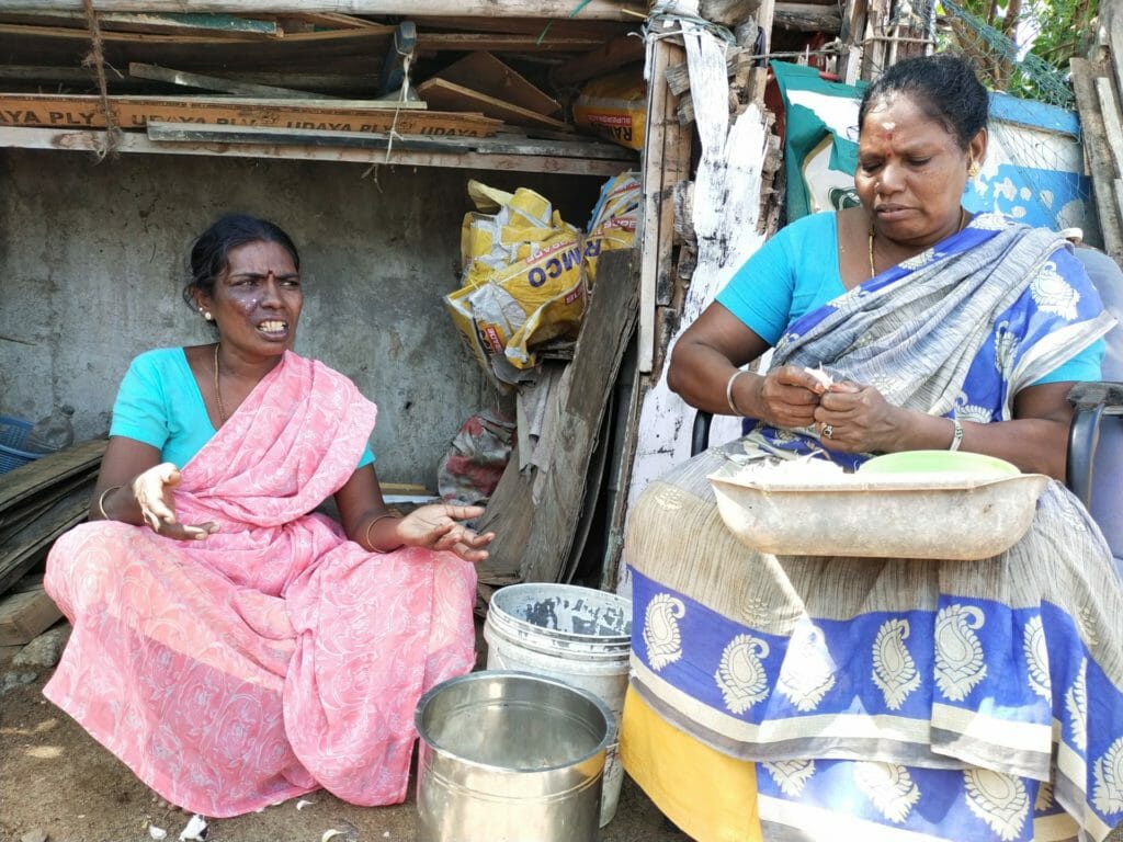 Women in Thideer Nagar peeling off garlics to make a living