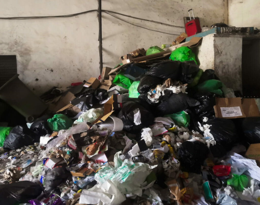 Garbage and garbage bags dumped atop of each other at the dry waste segregation centre