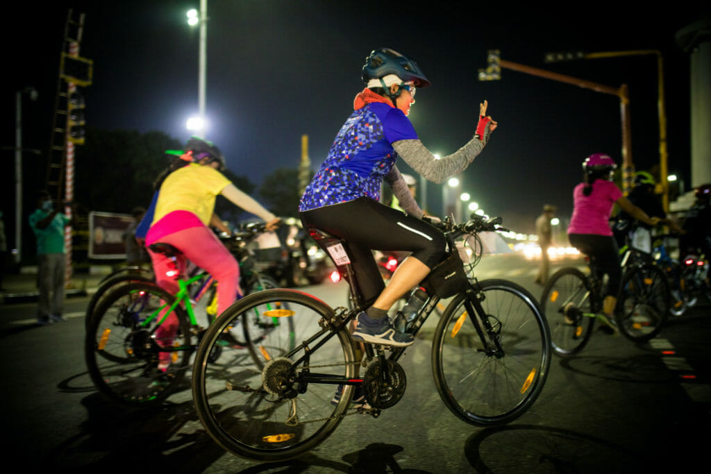 women in Chennai cycling at night time 