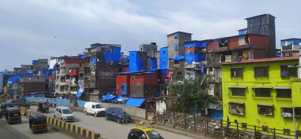 View of slums in Mumbai across a main road