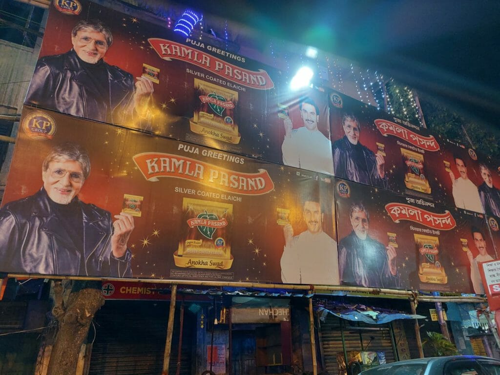 Advertisement banners lining the road leading up to a Durga Puja pandal
