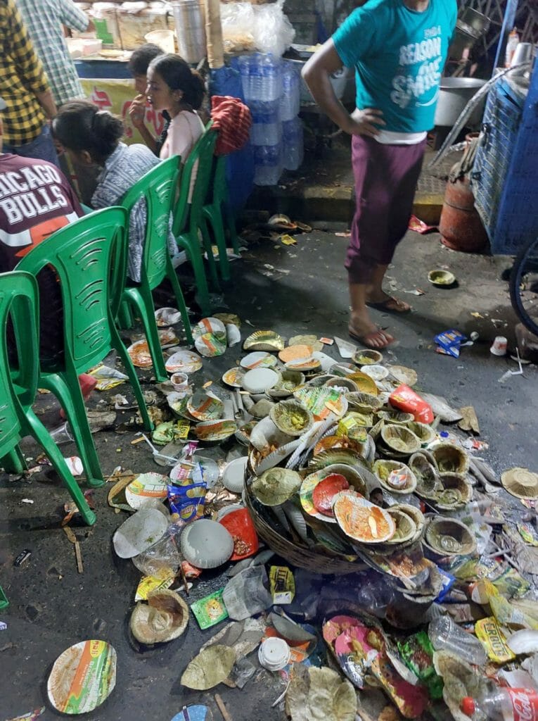 Waste generated by the crowds outside street food stalls