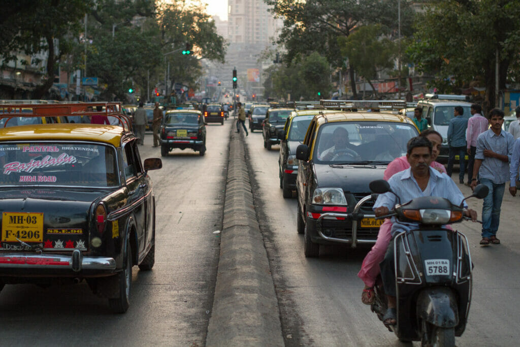 Road traffic in Mumbai. The picture shows a lot of kaali-peeli taxis. 