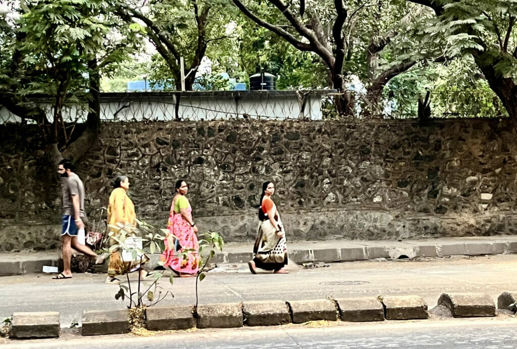 women walking on the road