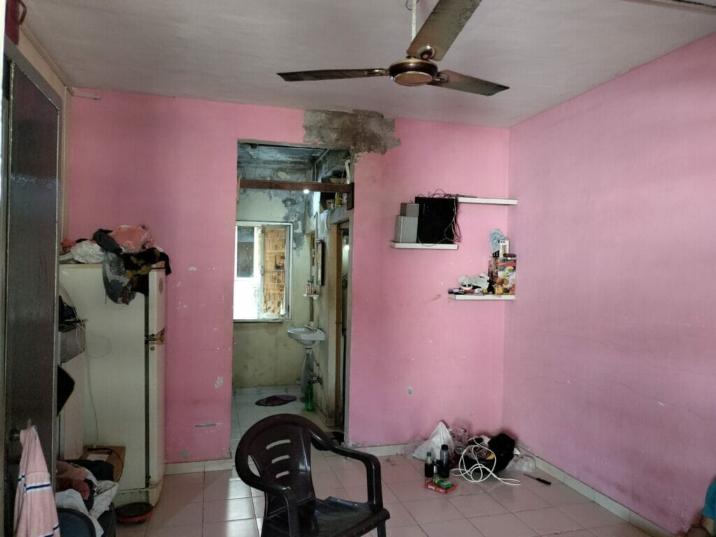 A small pink one room and kitchen in one of the buildings in Mahul