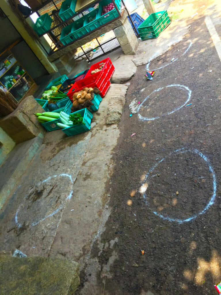 Spots chalked out in front of a grocery store to ensure social distancing to prevent the spread of COVID-19 infections