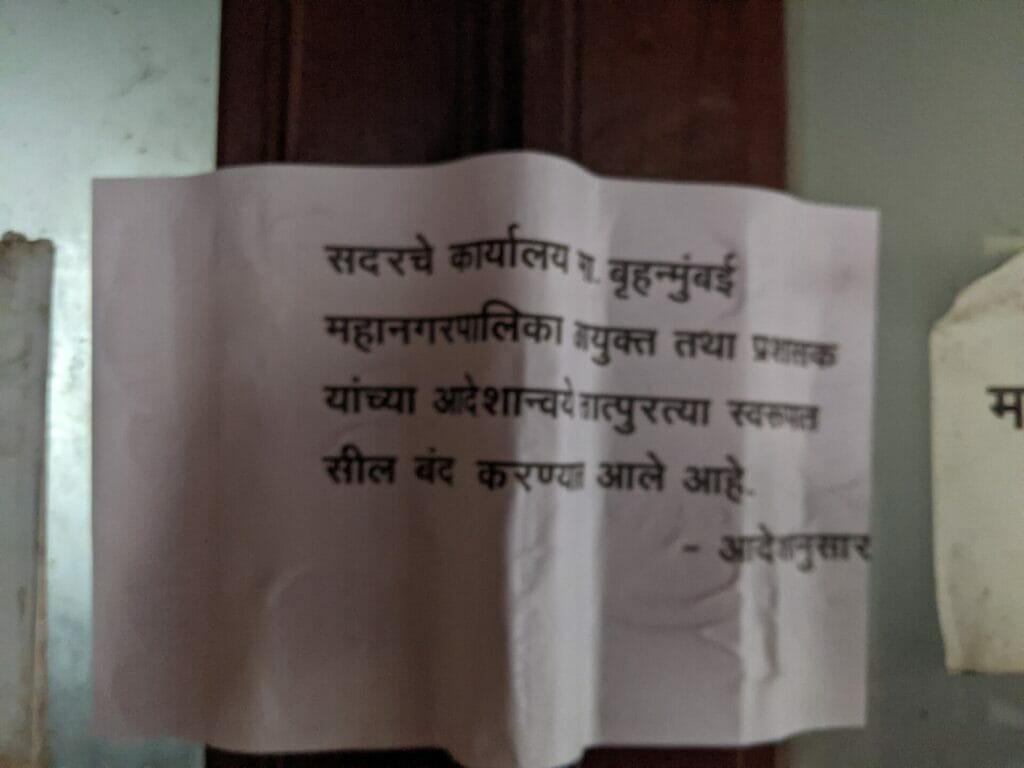 Notice on the door in Marathi that reads the offices are sealed on the orders of BMC administrator.