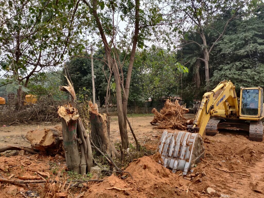 Construction debris and uprooted trees on Bellary Road. 