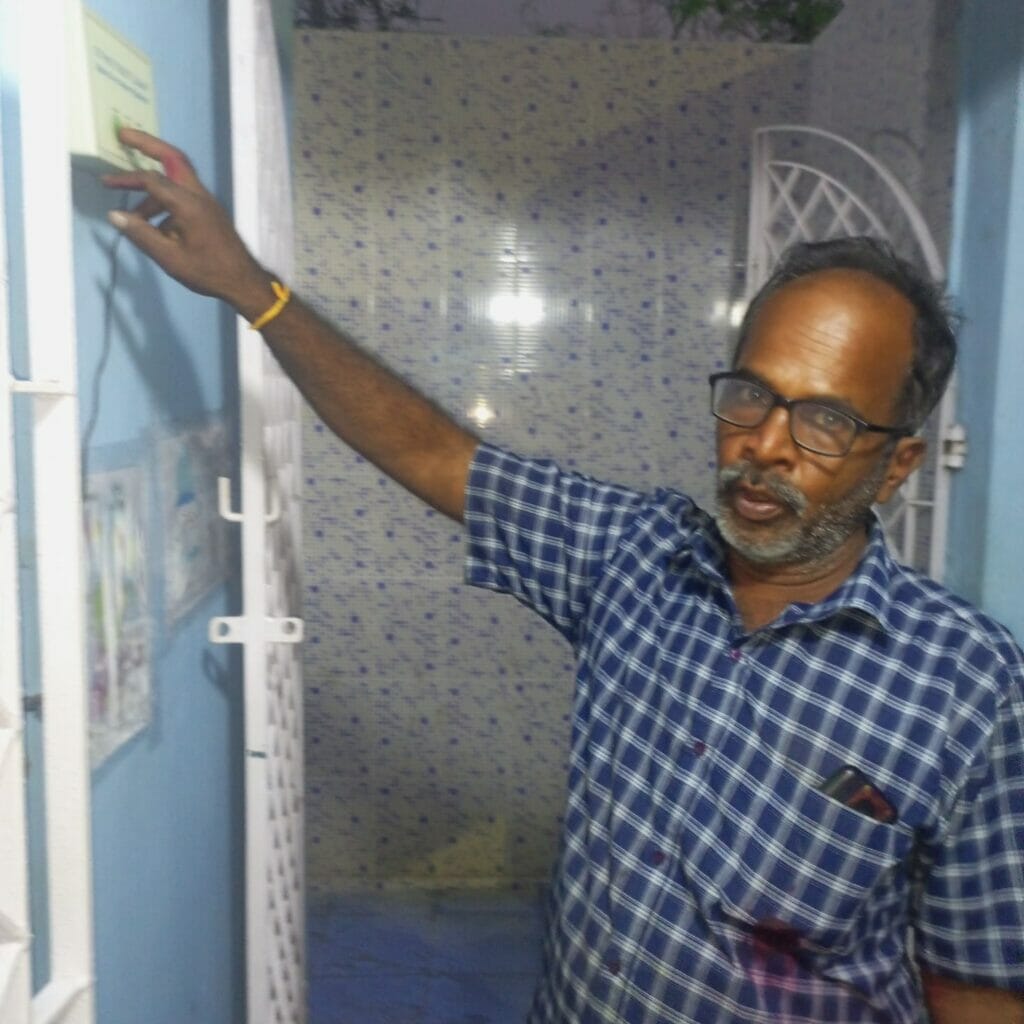 man using feedback machine in public toilet in chennai