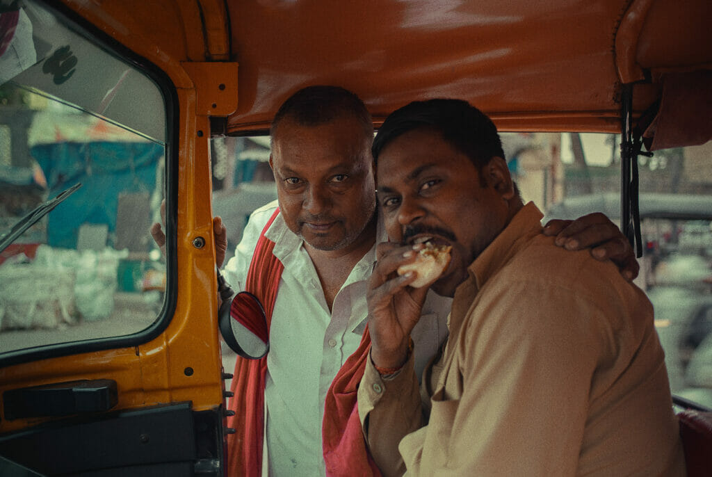 Two men in a rickshaw