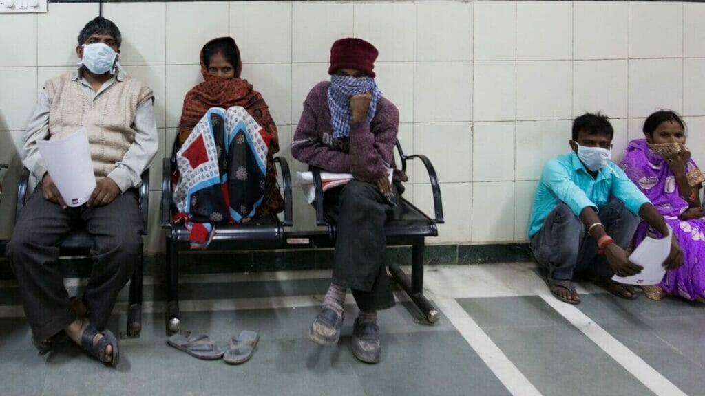 People sitting in a hospital corridor