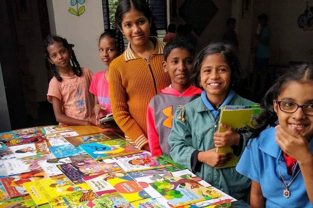 Children choosing books in a school library