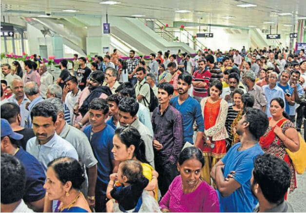 People standing in queue in the metro station