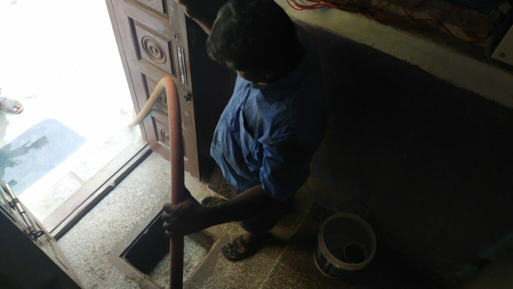 Kannan checks for blockage using the jet-rodding machine at an individual's house in Chennai.